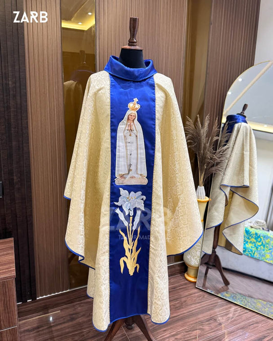 Ecclesiastical vestment with embroidered design on a mannequin against a wooden wall.