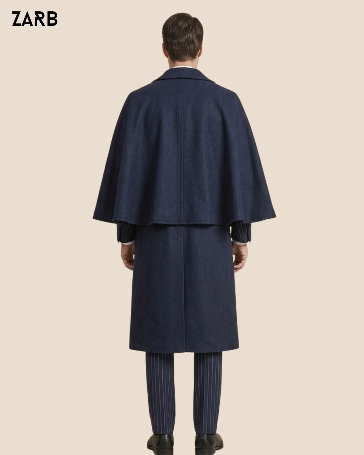Back view of navy blue Inverness cape coat with long Edwardian formal silhouette