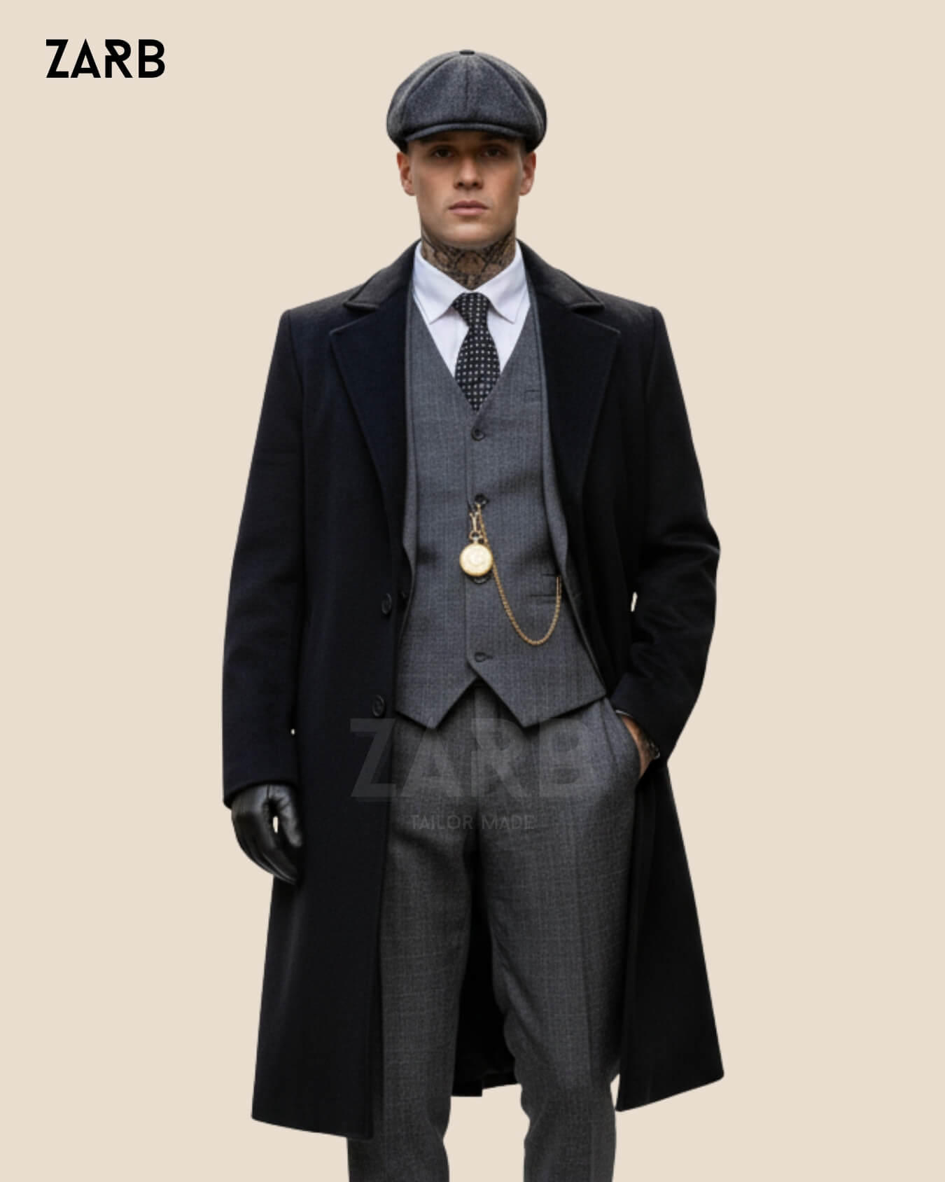 Man wearing a black long coat and gray suit with a flat cap.